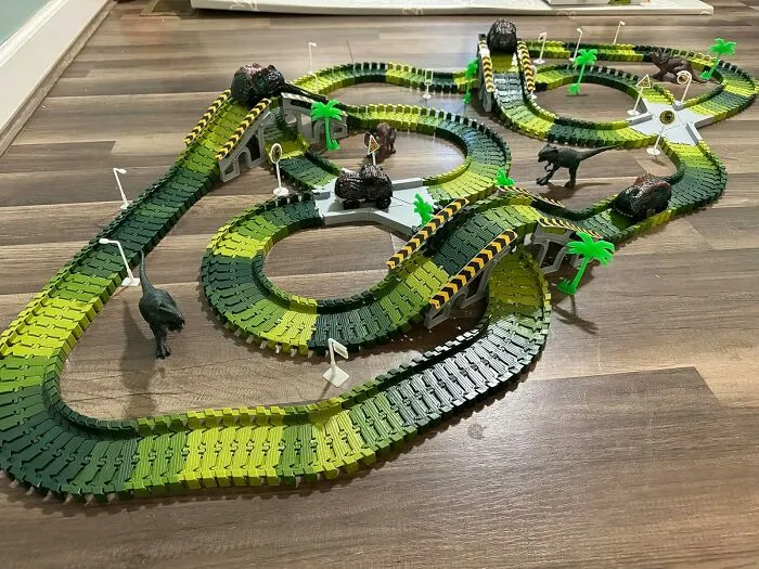 A <a Style="Display:inline;" Href="Https://Www.amazon.com/Dinosaur-156pcs-Create-Flexible-Playset/Dp/B07s6fdhpn?ie=utf8&th=1&linkcode=ll1&tag=bpoctopus-20&linkid=62934bd290b0ea98080133e6992b4119&language=en_us&ref_=as_li_ss_tl" Target="_blank">   <span Style="Font: Inherit; Color: #d74b1f;"> Dinosaur World Racetrack </Span> Will Turn Your Living Room From A Regular, Boring Space Into A Prehistoric, High-Octane Raceway Where The Only Thing More Dangerous Than The Hairpin Turns Are The Tiny, Plastic Dinosaurs