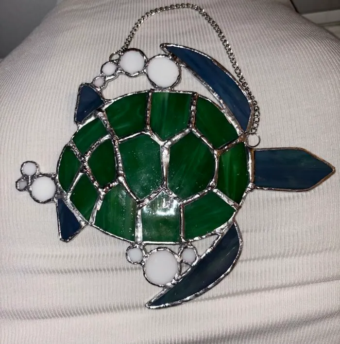 Their Window Is About To Get A Major Glow-Up, And They'll Get To Casually Mention, 'Oh, That Little Thing? I Made It,' To Every Single Person Who Visits Thanks To This <a Style="Display:inline;" Href="Https://Www.amazon.com/Studio-Pro-Pre-Cut-Stained-Glass/Dp/B0d8wr6hzk?ie=utf8&linkcode=ll1&tag=bpsquid-20&linkid=167419ef7b157f716b7b1930a393260f&language=en_us&ref_=as_li_ss_tl" Target="_blank">   <span Style="Font: Inherit; Color: #d74b1f;"> Stained Glass Sea Turtle Kit </Span>