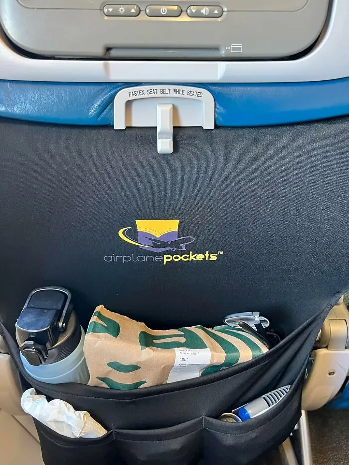 The Grimy, Mysterious, And Probably Haunted Seat Back Pocket Can Now Be Avoided Entirely Thanks To Your Own, Personal <a Style="Display:inline;" Href="Https://Www.amazon.com/Airplane-Tray-Cover-Travel-Essentials/Dp/B07wcxp7ch?ie=utf8&linkcode=ll1&tag=bpwombat-20&linkid=0dd3b87da229ee332676b22da33960b3&language=en_us&ref_=as_li_ss_tl" Target="_blank">   <span Style="Font: Inherit; Color: #d74b1f;"> Airplane Pockets </Span>