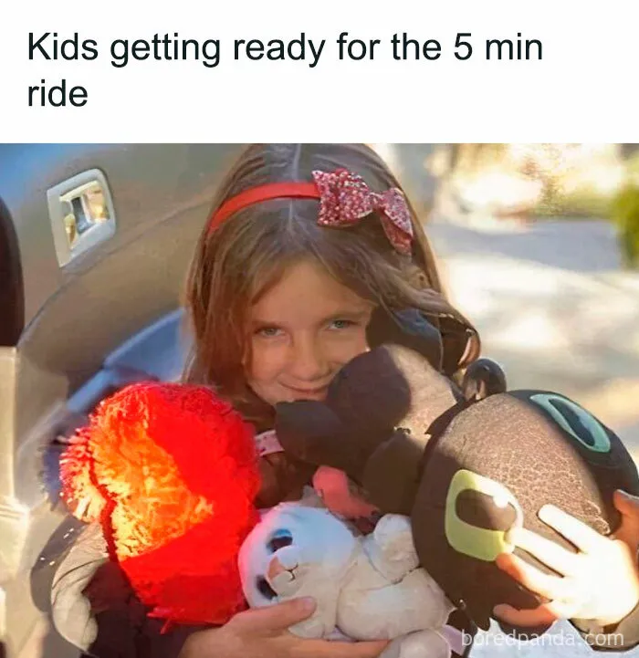 Young girl hugging multiple stuffed animals with a red bow, illustrating relatable memes for parents going through it.