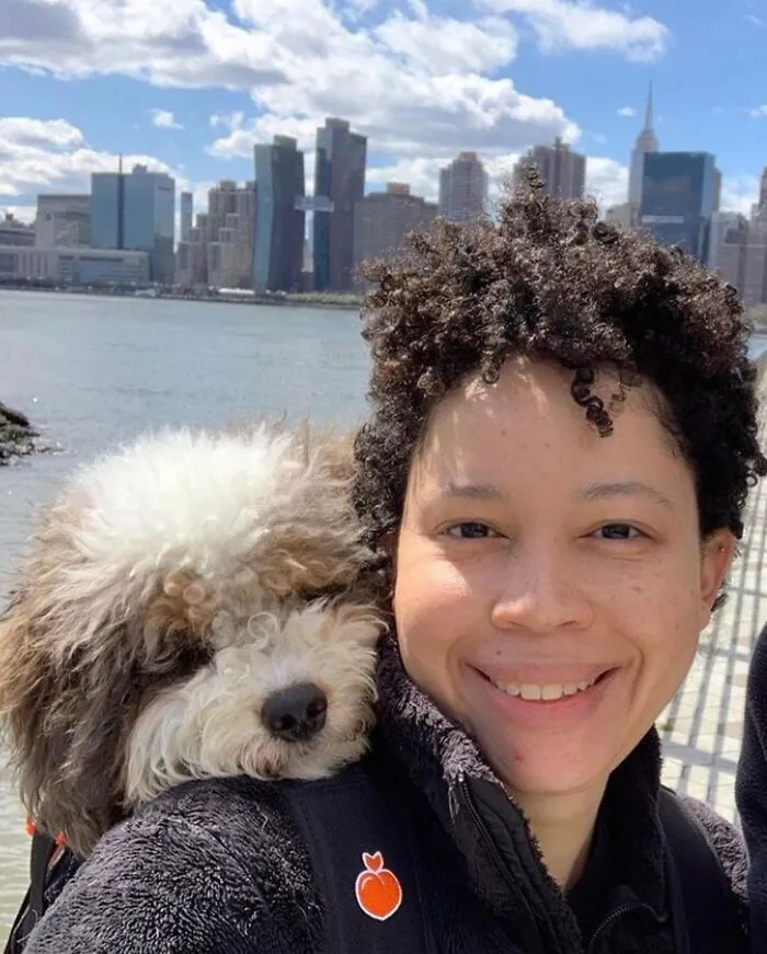 44 Wholesome Photos Of Pups Being Carried Through Cities In Backpacks