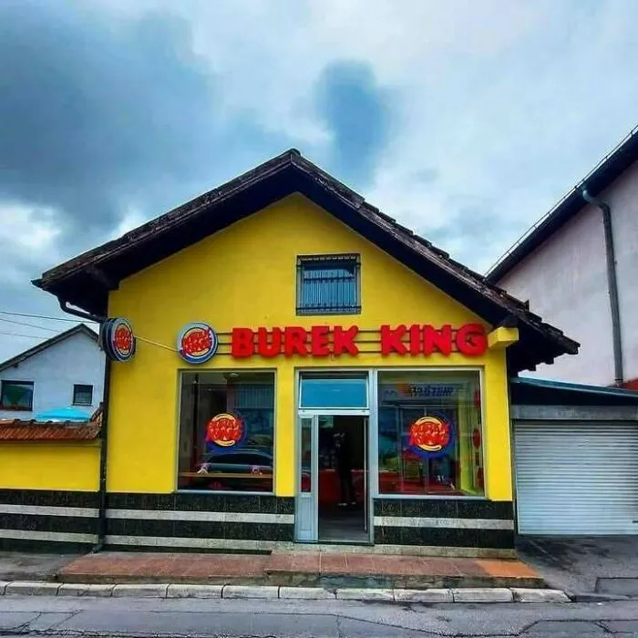 Small yellow building with Burek King signage, a humorous fast food reference popular in Eastern Europe culture.