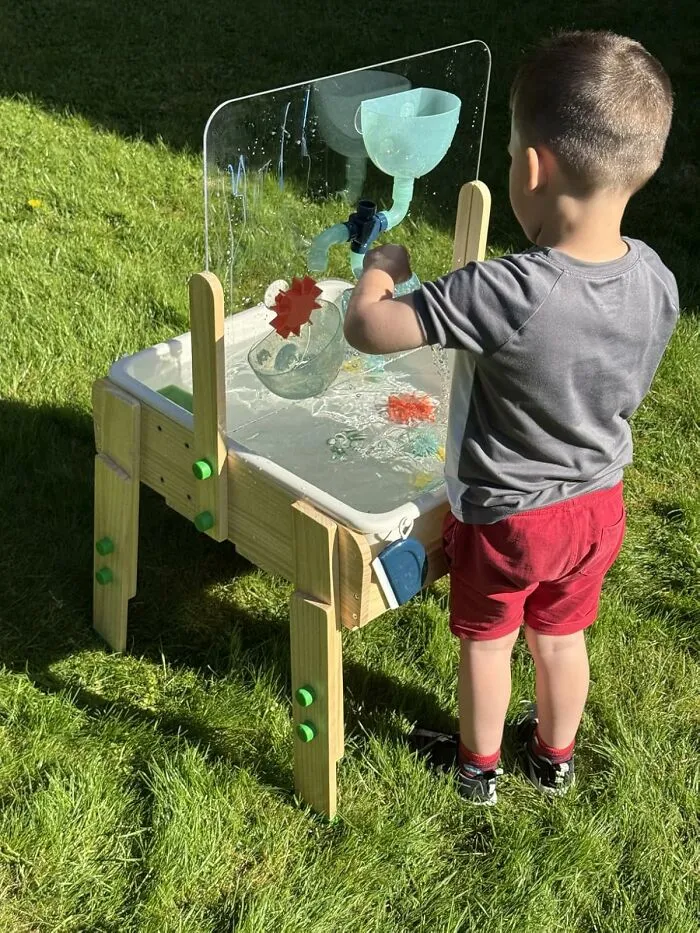 Your Living Room Can Now Be Transformed Into A Miniature, Slightly Chaotic, And Deeply Messy Beach Resort With A <a Style="Display:inline;" Href="Https://Www.amazon.com/Kiwico-Water-Sensory-Table-Accessory/Dp/B0cwpzwrq7?ie=utf8&linkcode=ll1&tag=bpgoat-20&linkid=6493f63c3cd470157fd2d6af6ca35e90&language=en_us&ref_=as_li_ss_tl" Target="_blank">   <span Style="Font: Inherit; Color: #d74b1f;"> Water And Sand Sensory Table </Span>