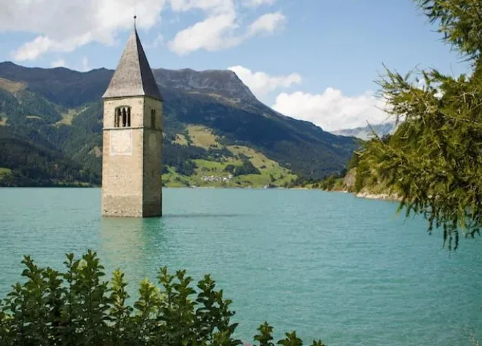 Italy. The Church Tower Of A Flooded Village