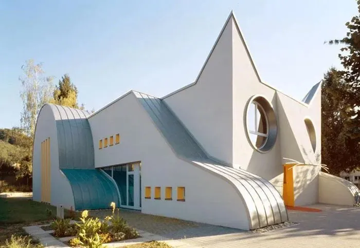 The Kindergarten "Katze" (Cat) In Karlsruhe-Wolfartsweier, Germany. Right Over The Left Paw Two Small Windows At A Yellow House Can Be Seen. That Once Was My Bedroom