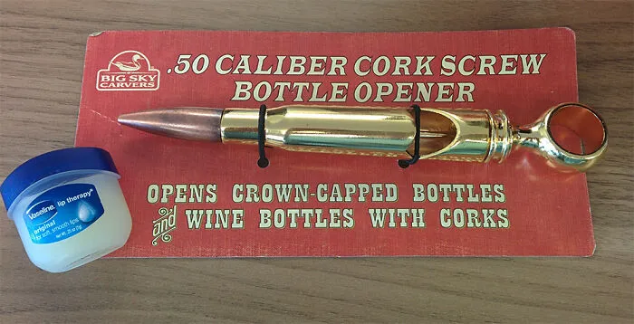 .50 caliber cork screw bottle opener designed as a bullet, one of hilariously bad Secret Santa gifts received alongside lip balm.