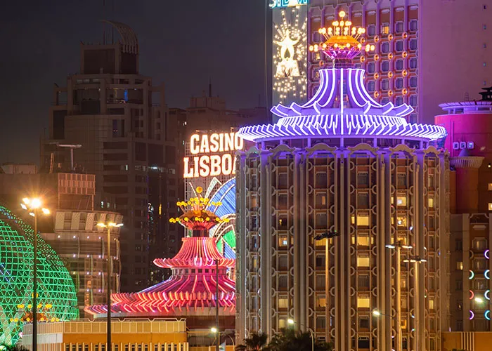 Night view of chaotic neon-lit buildings with colorful lights and casino signs creating a chaotic scene with many witnesses.