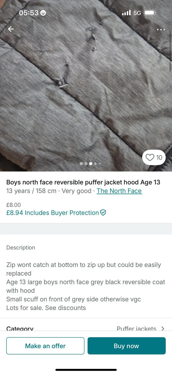 Worn grey boys North Face reversible puffer jacket listing with zipper issues on resale platform Vinted post.