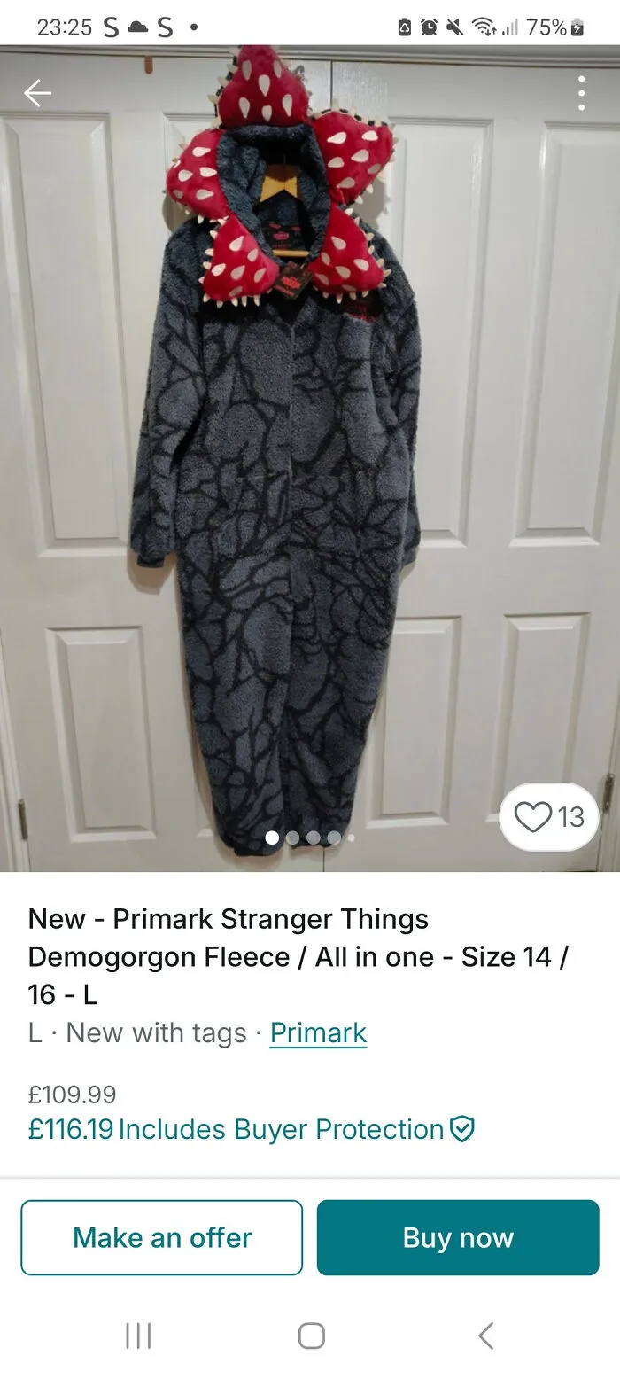 Primark Stranger Things Demogorgon fleece all-in-one costume hanging against white doors on Vinted listing.