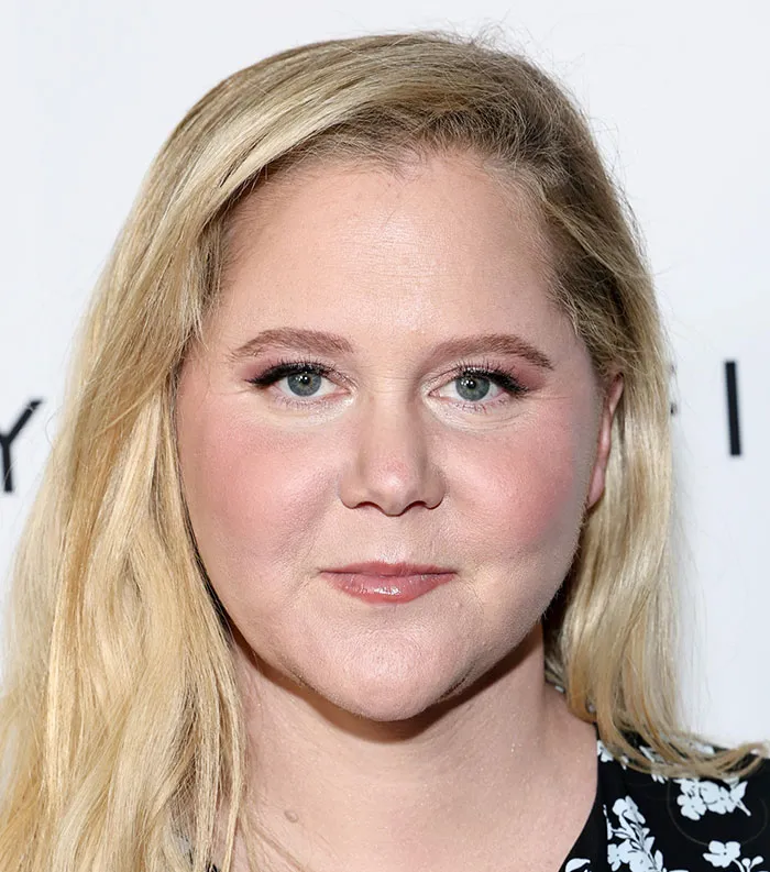 Close-up portrait of a blonde woman with light makeup representing most disliked celebrities of 2025.