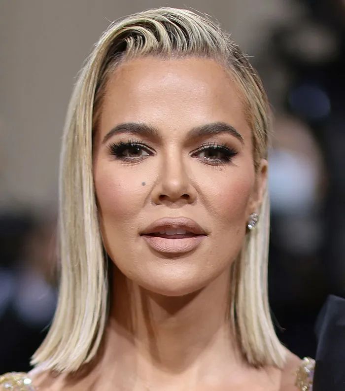 Close-up of a blonde celebrity with makeup, representing the most disliked celebrities of 2025 in a formal setting.