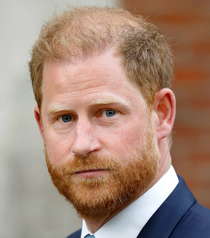 Close-up of a red-haired man in a suit, representing one of the most disliked celebrities of 2025 in public opinion.