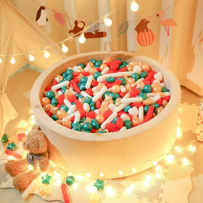 A Bag Of <a Style="Display:inline;" Href="Https://Www.amazon.com/Starbolo-Toddler-150pcs-Phthalate-Plastic/Dp/B0d1wyd4m6?ie=utf8&th=1&linkcode=ll1&tag=bpoctopus-20&linkid=e725f90852cb101aa48631fffa88b3c1&language=en_us&ref_=as_li_ss_tl" Target="_blank">   <span Style="Font: Inherit; Color: #d74b1f;"> Christmassy Ballpit Sprinkles </Span> Will Turn Your Regular, Boring Ball Pit Into A Festive, Slightly Chaotic, And Deeply Instagrammable Winter Wonderland That You Will Be Finding Under Your Couch Cushions Until June