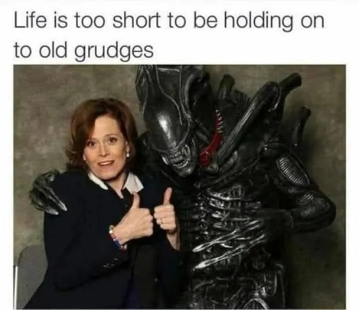 Woman giving thumbs up next to alien creature with caption about letting go of old grudges relatable memes.