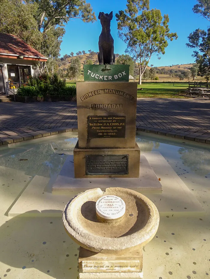 Pioneer Monument at Tucker Box tourist attraction in a park with clear blue sky and greenery.