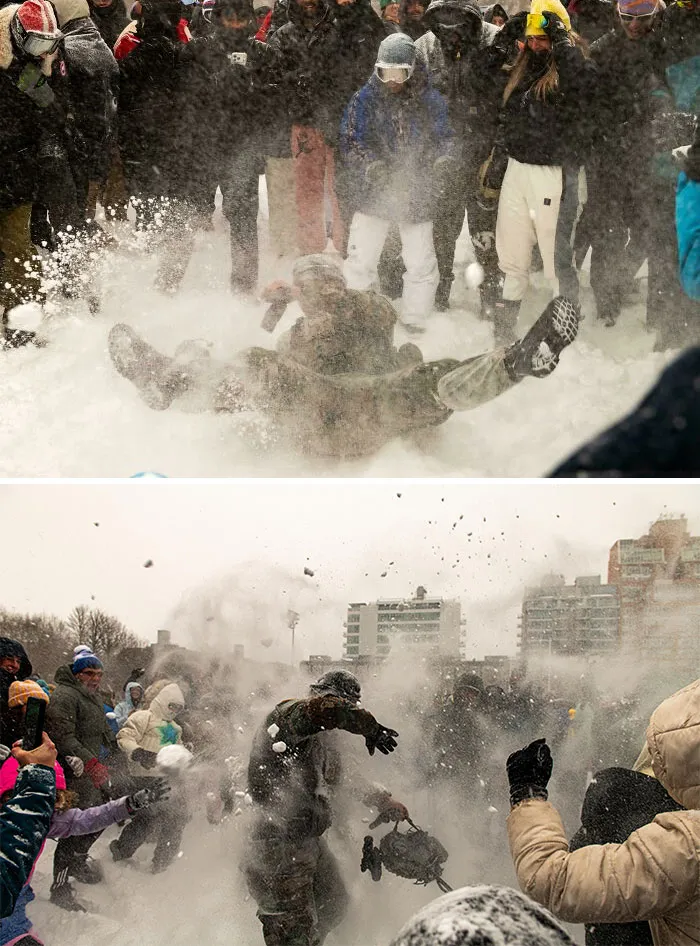 Crowd enjoying a lively snowstorm in the U.S. with snowball fights and people playing in the heavy snow.