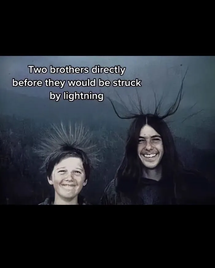 Two boys smiling with hair standing on end, illustrating a scary fact about electricity and wet bones before lightning strike.
