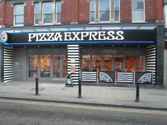 Pizza Express restaurant exterior on a city street, illustrating a local inside joke shared by people in the area.