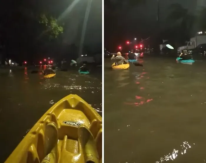 People kayaking through flooded streets at night, showcasing one of the weirdest things found in the streets.