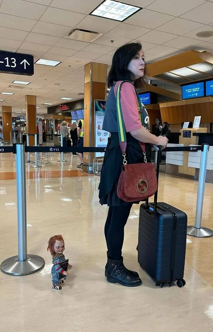 Jennifer Tilly Does Her Traveling With A Small Chucky Doll At Her Side