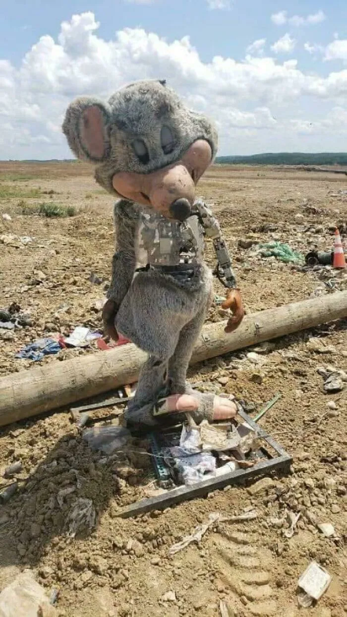 An Old Chuck E Cheese Animatronic Robot Sitting In The Desert