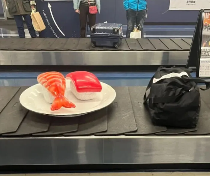 At Oita Airport In Japan, They Place Giant Fake Sushi On The Luggage Carousel To Make It Resemble A Conveyor Belt Sushi Restaurant