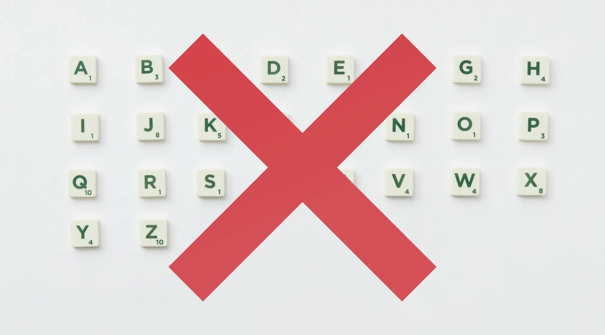 Scrabble letter tiles arranged in alphabetical order crossed out by a large red X indicating deadly decoys in non-Latin languages.