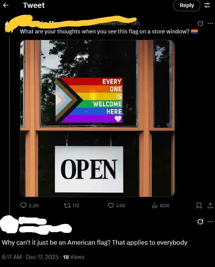 Screenshot of a tweet showing a pride flag on a store window with a dumb comment about the American flag.