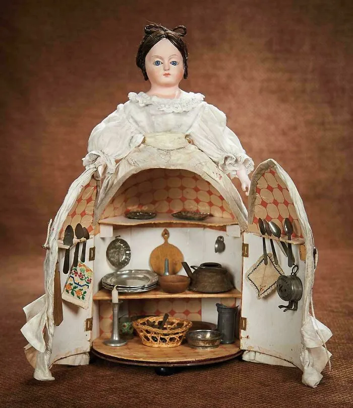 German Paper-Mache "Kitchen" Doll, The Cone-Shaped Skirt Unhinges At Center Front To Reveal A Miniature Fitted Kitchen. 1870