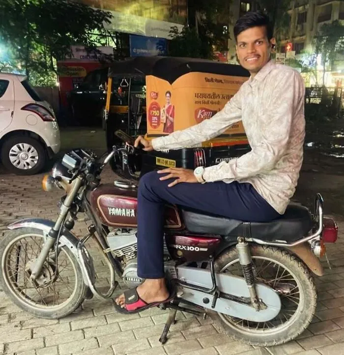 Tall man sitting on a motorcycle, highlighting common struggles only tall people face in everyday situations.