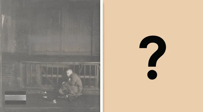 1999 album cover featuring Eminem sitting by a wooden fence, related to album mainstream breakthrough SEO keywords.