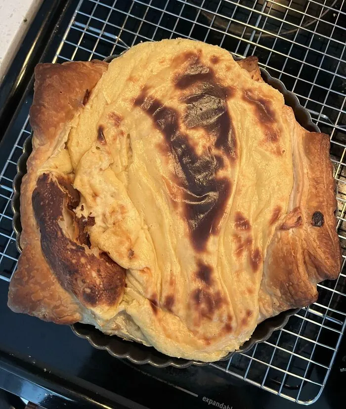 Burnt and misshapen dessert with unevenly cooked crust, showing a clear example of how people managed to ruin dessert.