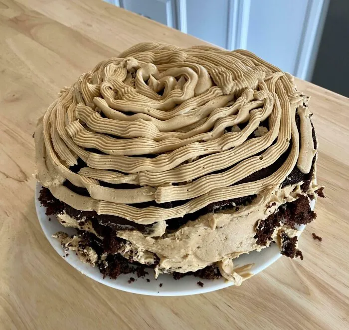 Cake with uneven layers and messy frosting, an example of how people managed to ruin dessert unexpectedly.