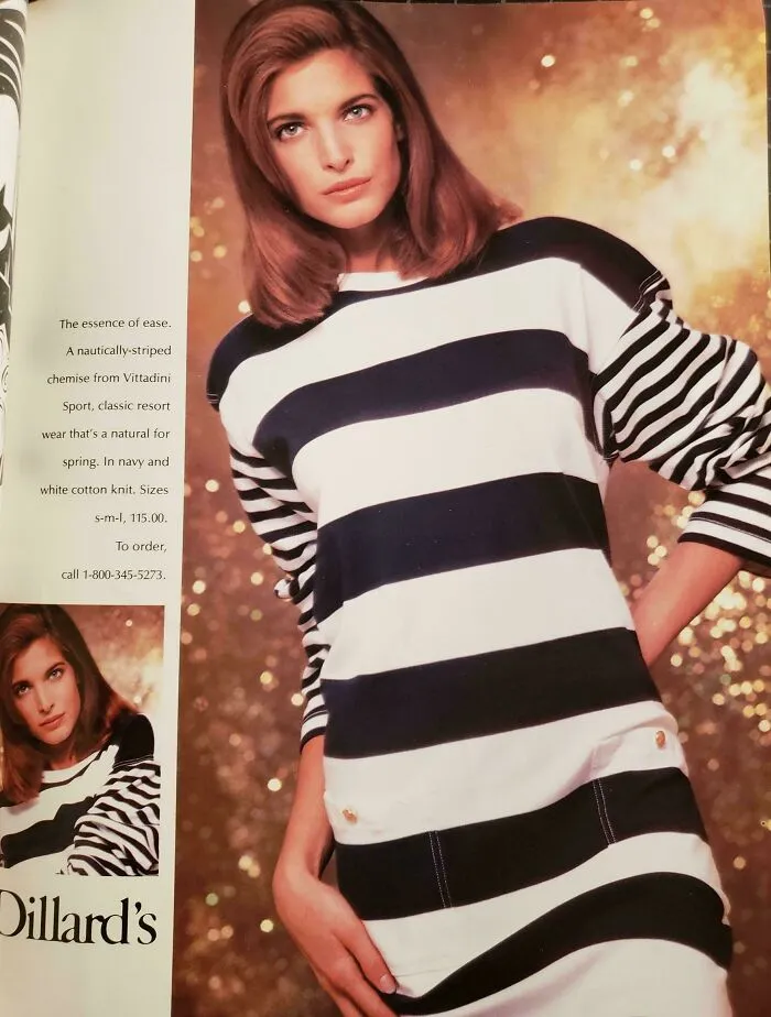 Vintage women’s ad featuring a model in a navy and white striped sweater showcasing retro fashion style.