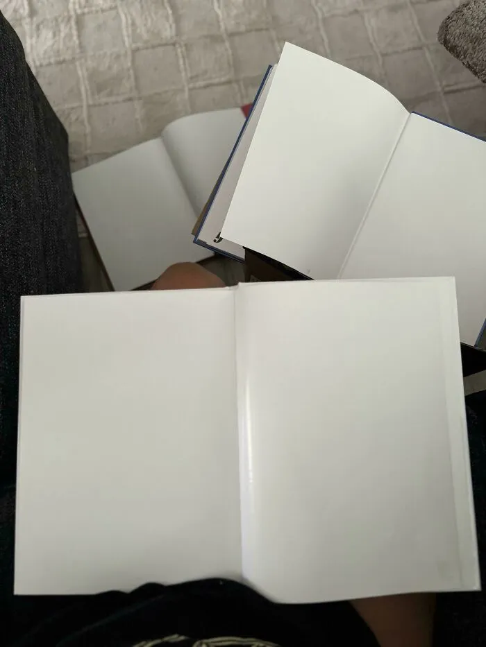 Blank pages inside multiple opened books, an unfortunate event that might make you feel better about your day.