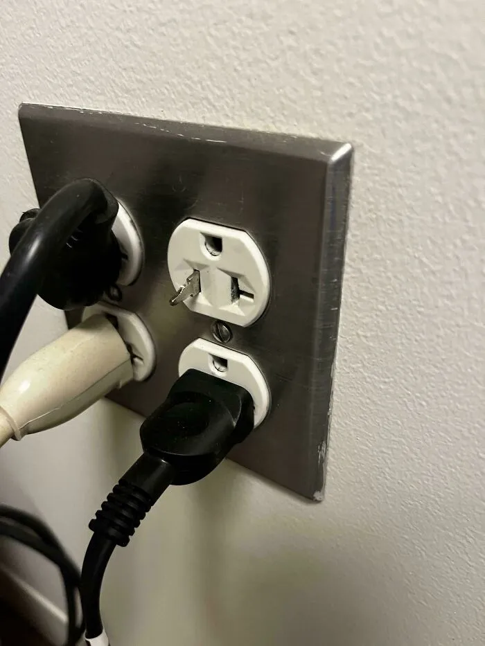 Electrical outlet with a broken prong stuck inside, one of many unfortunate events that can make you feel better about your own day.