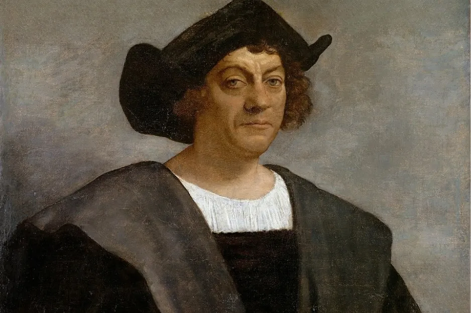Portrait of European explorer Christopher Columbus wearing a black hat and dark Renaissance clothing.