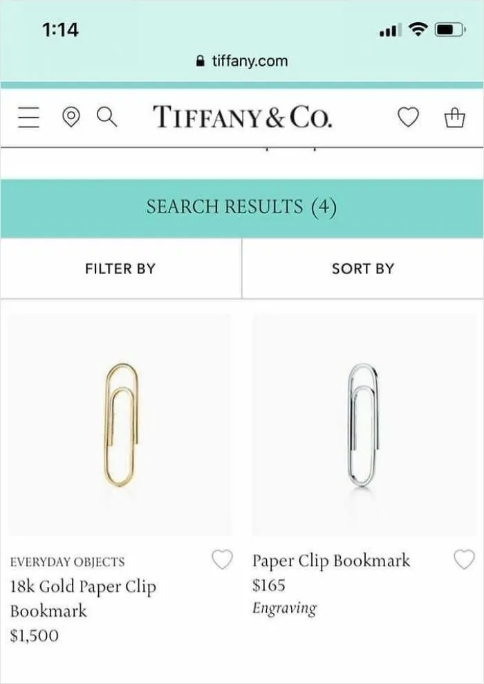 Website screen showing luxury gold and silver paper clip bookmarks with prices, highlighting dystopia in everyday objects.