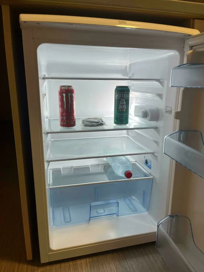 Open fridge with few items inside, illustrating a horrifying find shared by people on the internet.