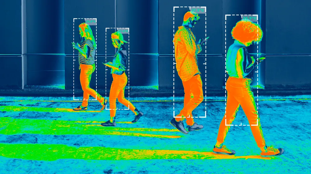 Thermal imaging camera view showing people’s heat signatures using the infrared part of the electromagnetic spectrum.