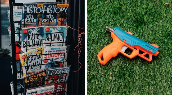 Magazines on display rack next to a toy gun on grass, illustrating versatile words connected to publishing and firearms quiz.