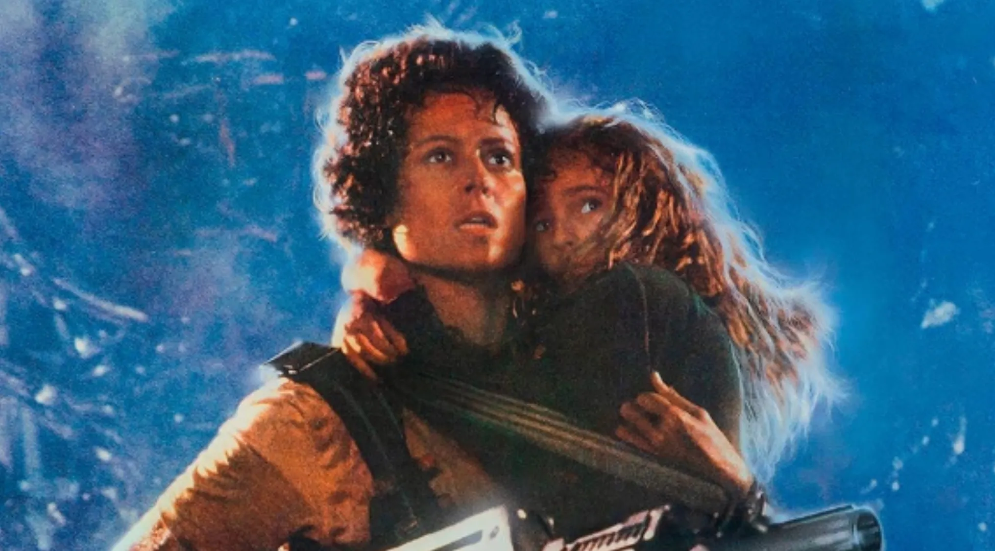 Woman holding child in a tense scene from James Cameron's 1986 movie nominated for seven Academy Awards.