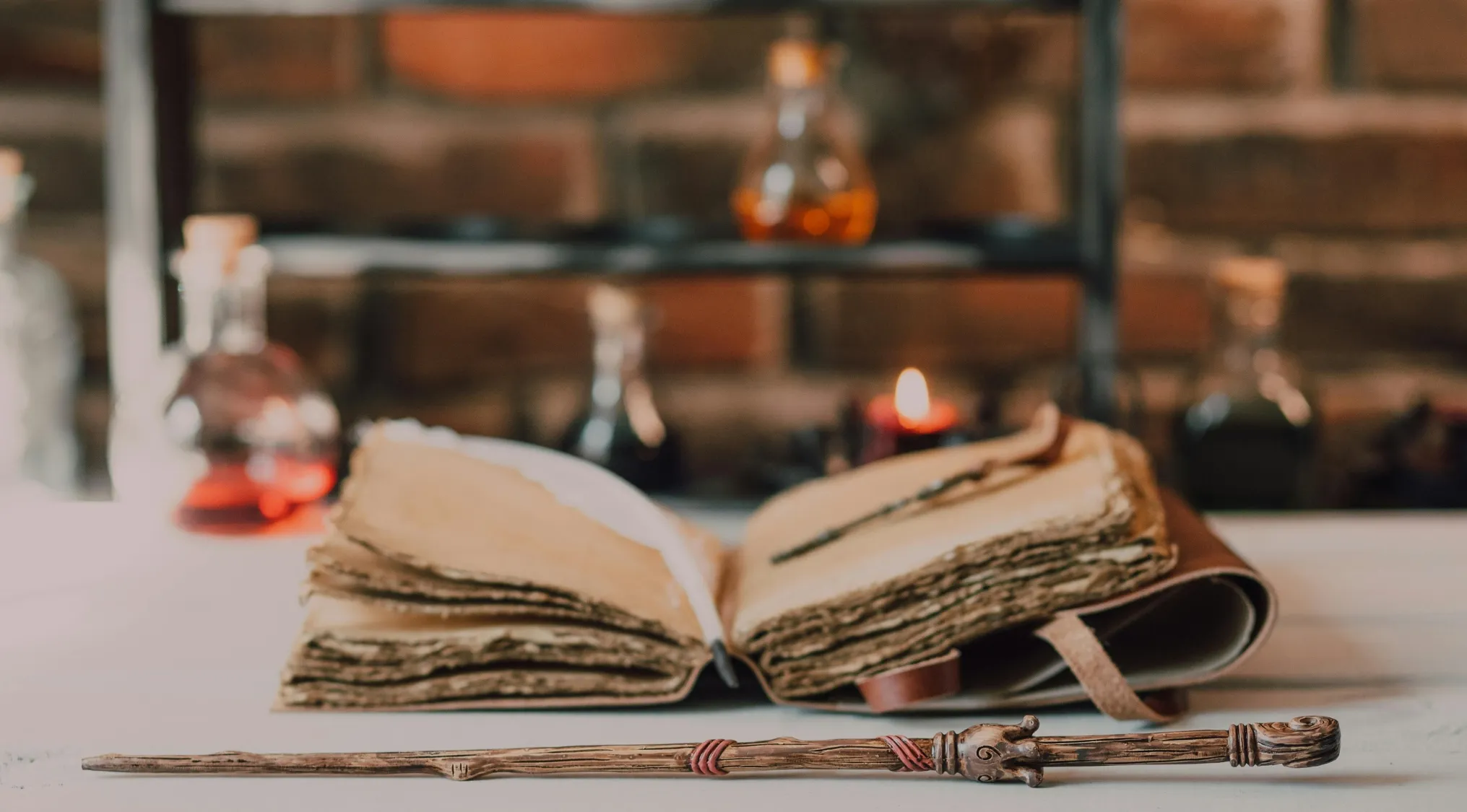 An old spellbook with a magical wand resting on a table in a setting evoking J.K. Rowling’s world of magic and spells.