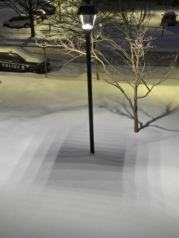 This Shadow On The Fresh Snow From An LED Street Lamp