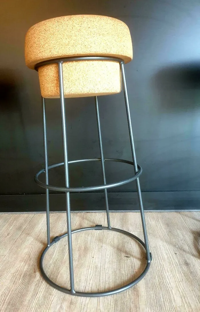 Modern minimalist bar stool with metal frame and cushioned seat