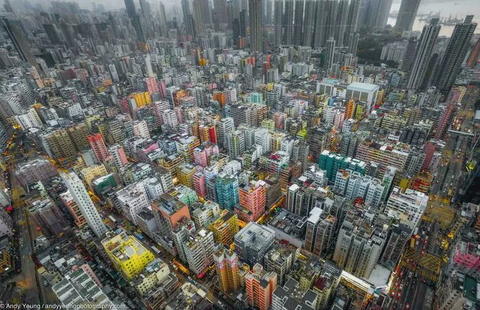 Dense dystopian urban hell cityscape with high-rise buildings packed tightly, illustrating the true price of modern life.