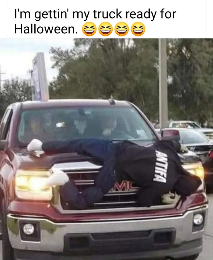 Truck decorated with Halloween tough guy mannequin on hood