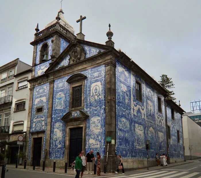 Beautiful architecture: A stunning church facade covered in blue and white azulejo tiles, showcasing unique artistry.