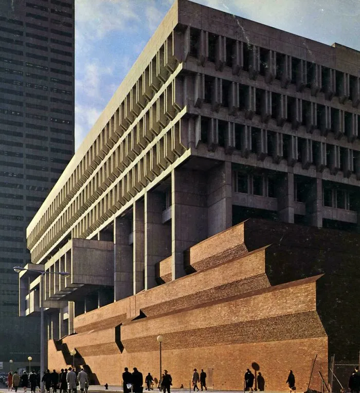 Brutalist architecture building with tiered brick base and concrete facade, a beautiful example.