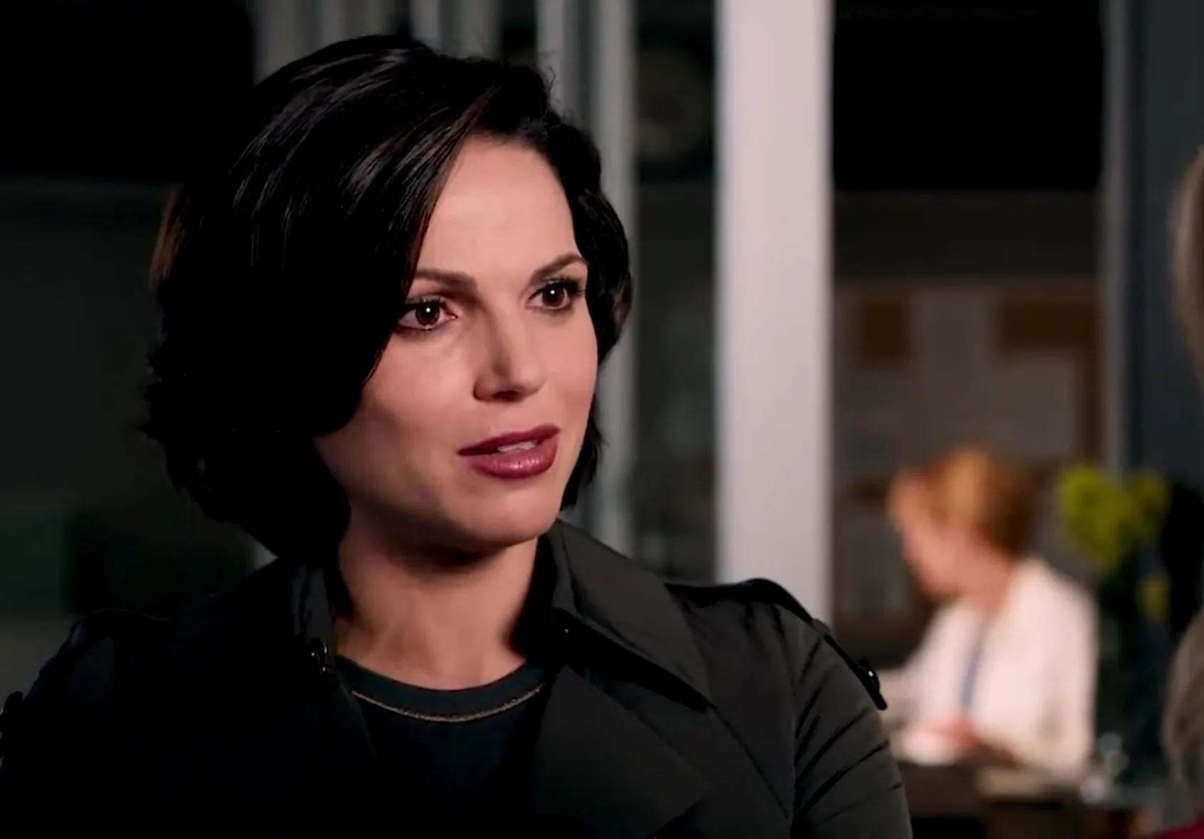 Woman with short dark hair speaking in an indoor setting, related to the character teen daughter Lorelai Regina Mills.